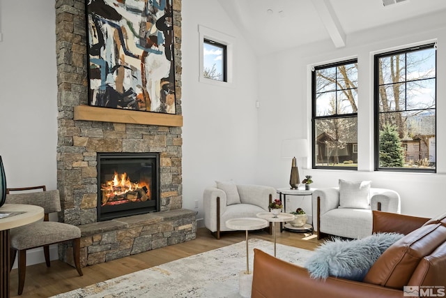 4060 Goodsell Ln, Reno, NV 89523 - living area with wood finished floors, a stone fireplace, and plenty of natural light