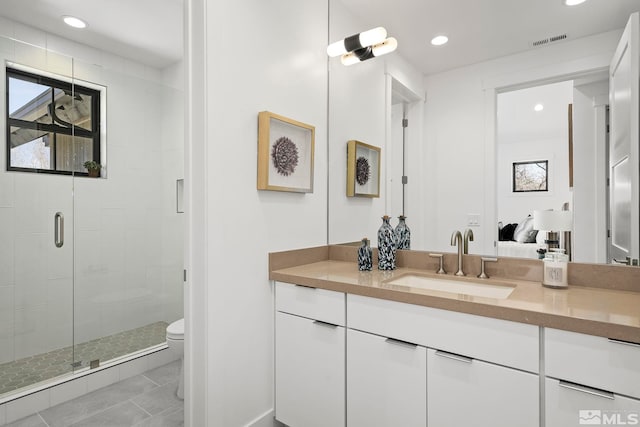 4060 Goodsell Ln, Reno, NV 89523 - full bath featuring toilet, a stall shower, recessed lighting, vanity, and plenty of natural light