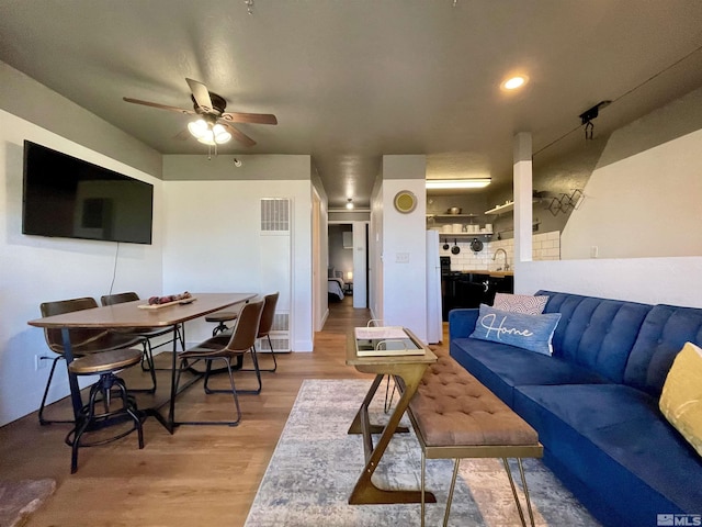 261 Quaking Aspen Ln Unit B, Stateline, NV 89449 - living area featuring light wood-style flooring, a ceiling fan, and a heating unit
