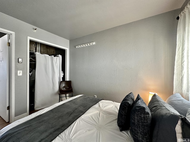 261 Quaking Aspen Ln Unit B, Stateline, NV 89449 - bedroom with a textured wall and a closet