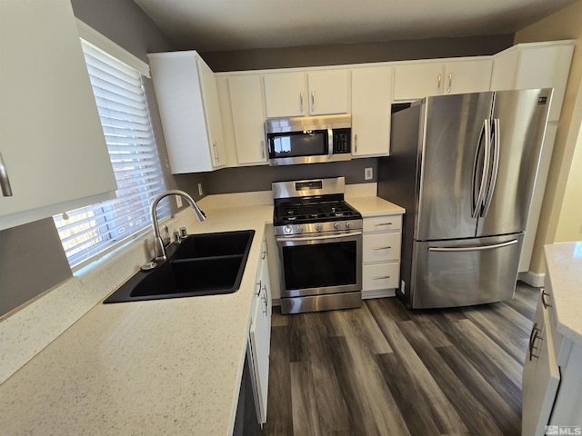 495 Len Cir, Reno, NV 89511 - kitchen featuring appliances with stainless steel finishes, a sink, light countertops, and white cabinets
