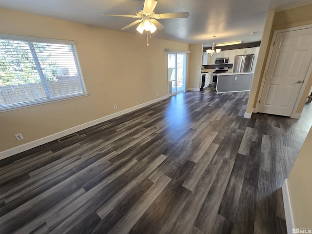 495 Len Cir, Reno, NV 89511 - unfurnished living room featuring a chandelier, baseboards, ceiling fan, and dark wood-type flooring