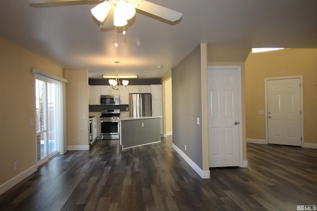 495 Len Cir, Reno, NV 89511 - kitchen with stainless steel appliances, dark wood finished floors, a chandelier, white cabinets, and light countertops