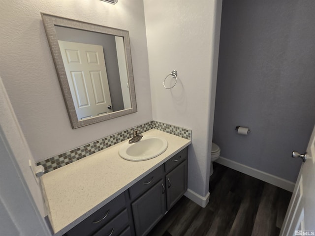 495 Len Cir, Reno, NV 89511 - half bath with wood finished floors, toilet, vanity, and baseboards