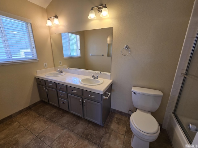 495 Len Cir, Reno, NV 89511 - full bathroom with toilet, baseboards, double vanity, and tile patterned flooring