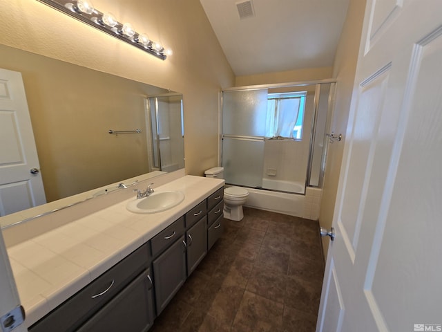 495 Len Cir, Reno, NV 89511 - full bath with lofted ceiling, toilet, vanity, combined bath / shower with glass door, and tile patterned flooring