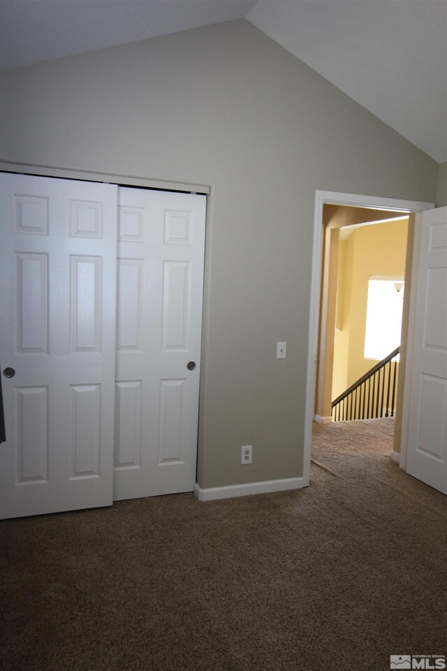 495 Len Cir, Reno, NV 89511 - unfurnished bedroom with vaulted ceiling, carpet floors, a closet, and baseboards