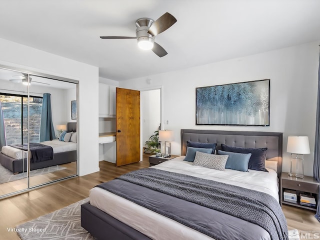 449 Andria Dr, Stateline, NV 89448 - bedroom with a closet, wood finished floors, and a ceiling fan
