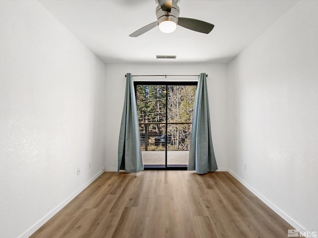 449 Andria Dr, Stateline, NV 89448 - spare room featuring wood finished floors, baseboards, and ceiling fan