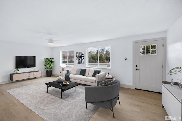 3575 Gull St, Reno, NV 89508 - living area featuring light wood-type flooring, ceiling fan, and healthy amount of natural light