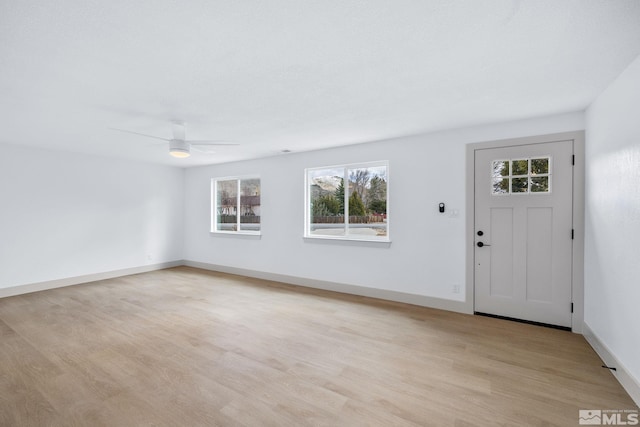 3575 Gull St, Reno, NV 89508 - foyer entrance with plenty of natural light, a ceiling fan, light wood-style flooring, and baseboards