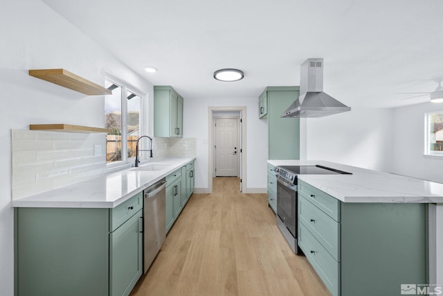 3575 Gull St, Reno, NV 89508 - kitchen featuring exhaust hood, green cabinetry, open shelves, and stainless steel appliances