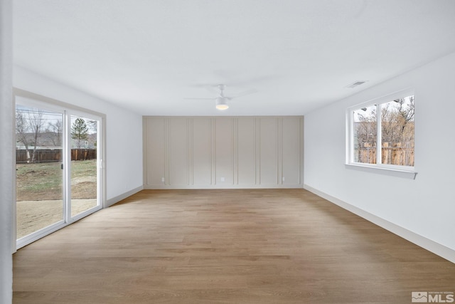 3575 Gull St, Reno, NV 89508 - unfurnished room with healthy amount of natural light, light wood-style floors, and a ceiling fan