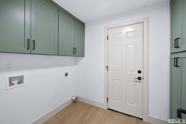 3575 Gull St, Reno, NV 89508 - clothes washing area featuring cabinet space, electric dryer hookup, light wood-style flooring, baseboards, and hookup for a washing machine