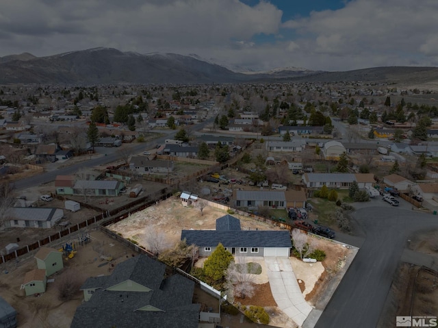 3575 Gull St, Reno, NV 89508 - aerial overview of property's location with a mountain backdrop and nearby suburban area