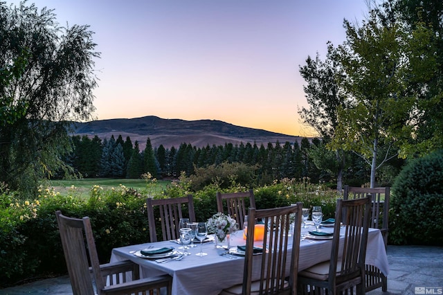 1185 Paddock Ln, Reno, NV 89521 - patio terrace at dusk featuring a mountain view and a forest view