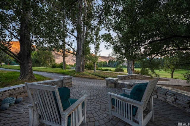1185 Paddock Ln, Reno, NV 89521 - view of home's community featuring a patio area and a lawn