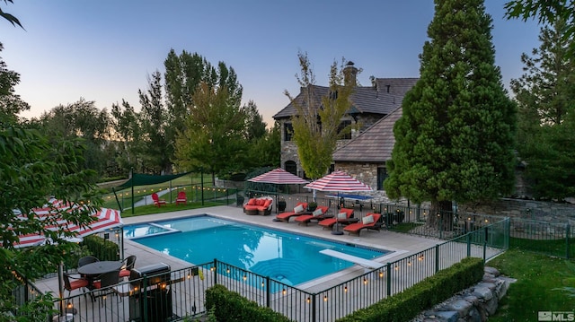 1185 Paddock Ln, Reno, NV 89521 - view of swimming pool featuring a diving board, fence, and a patio