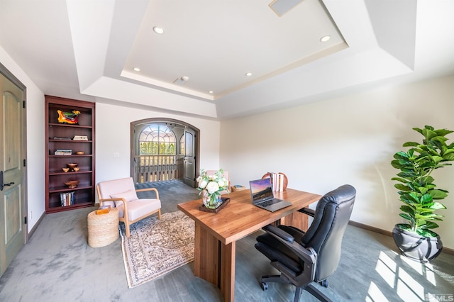 1185 Paddock Ln, Reno, NV 89521 - home office featuring a tray ceiling, arched walkways, baseboards, recessed lighting, and carpet flooring
