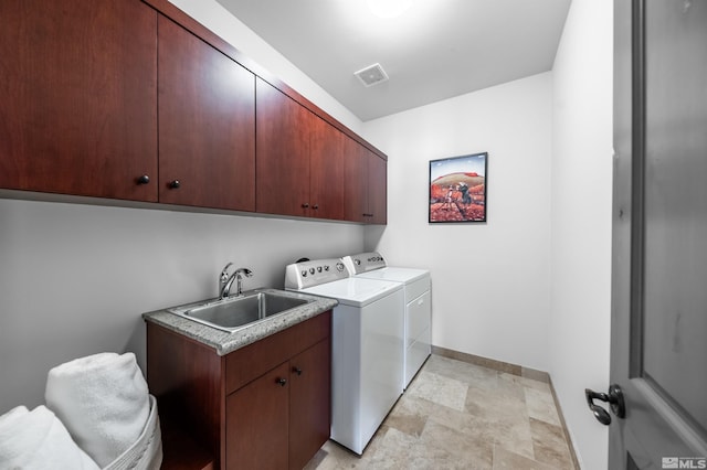 1185 Paddock Ln, Reno, NV 89521 - clothes washing area with cabinet space, washing machine and clothes dryer, stone finish flooring, and baseboards
