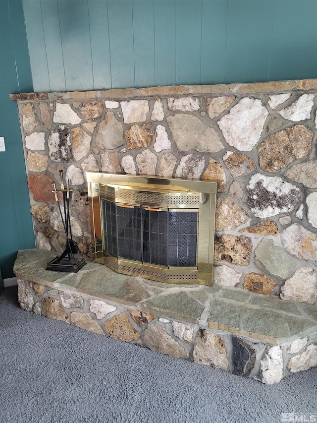 828 W Washington St, Carson City, NV 89703 - detailed view of carpet floors and a stone fireplace