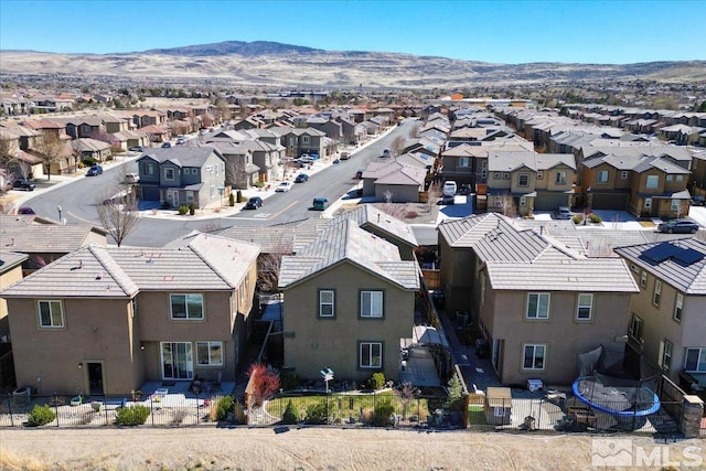 aerial view of residential area with mountains