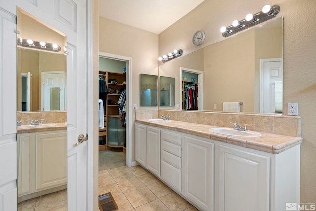 6658 Abbotswood Dr, Sparks, NV 89436 - full bathroom featuring double vanity, tile patterned flooring, and a walk in closet
