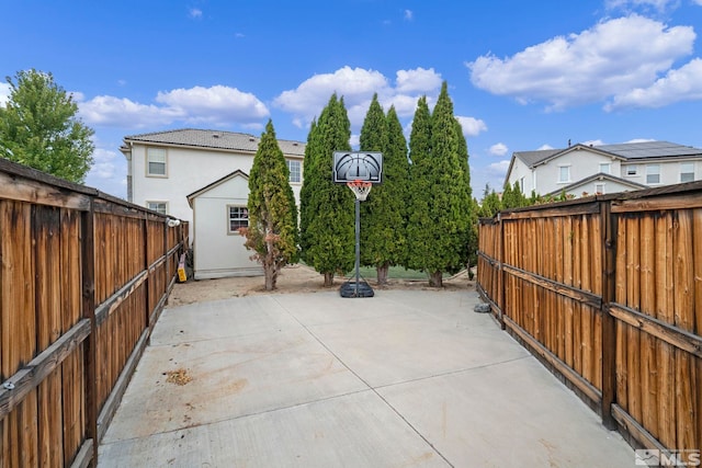 6658 Abbotswood Dr, Sparks, NV 89436 - view of patio / terrace featuring a fenced backyard and an outbuilding