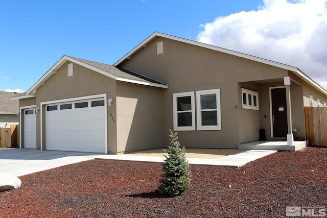 1332 Serenity Cir, Fernley, NV 89408 - single story home with a garage, stucco siding, fence, and concrete driveway