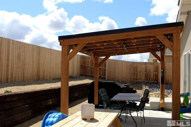 1332 Serenity Cir, Fernley, NV 89408 - view of patio / terrace with a fenced backyard and outdoor dining space