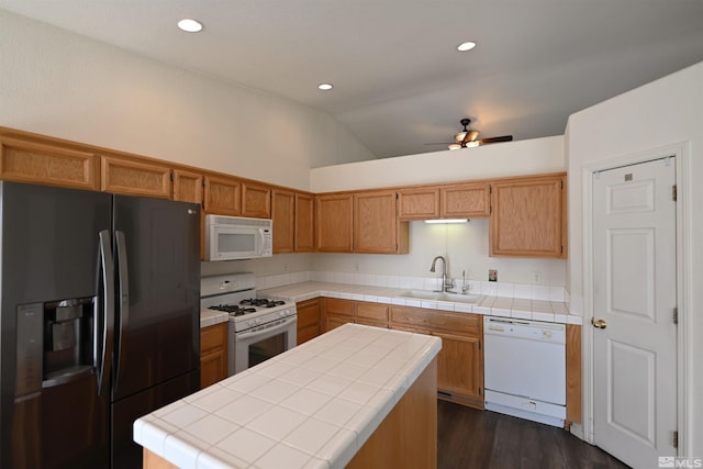 2129 Fort Bridger, Fernley, NV 89408 - kitchen featuring white appliances, a sink, tile counters, lofted ceiling, and a ceiling fan