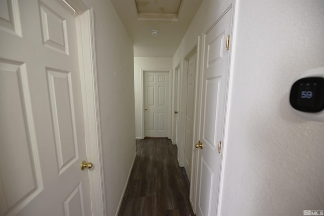 2129 Fort Bridger, Fernley, NV 89408 - hallway with dark wood-style flooring, baseboards, and attic access