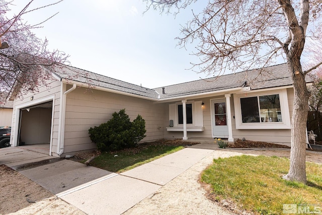 2225 Figoni Ranch Rd, Sparks, NV 89434 - ranch-style house with an attached garage, roof with shingles, a porch, and driveway