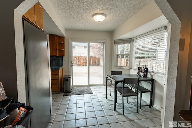 2225 Figoni Ranch Rd, Sparks, NV 89434 - dining area with a textured ceiling, light tile patterned flooring, and a textured wall