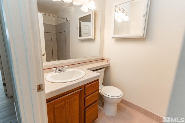 2225 Figoni Ranch Rd, Sparks, NV 89434 - bathroom with toilet, baseboards, vanity, and a shower
