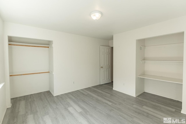 2225 Figoni Ranch Rd, Sparks, NV 89434 - unfurnished bedroom featuring a closet, wood finished floors, and baseboards
