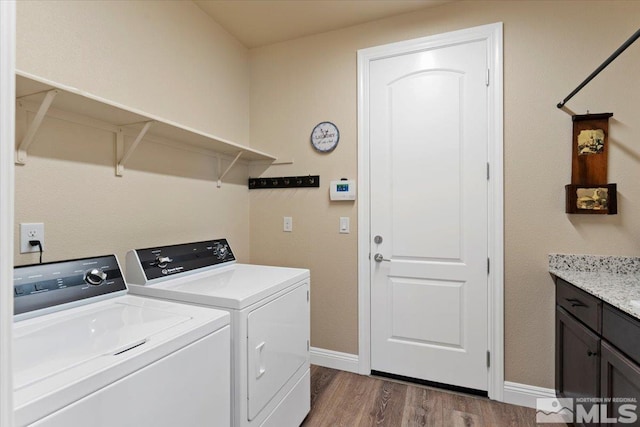 908 Sand Springs Dr, Sparks, NV 89441 - clothes washing area featuring independent washer and dryer, dark wood finished floors, cabinet space, and baseboards