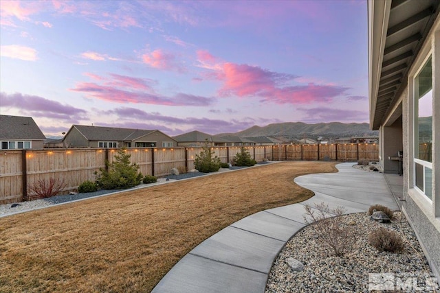 908 Sand Springs Dr, Sparks, NV 89441 - yard at dusk featuring a patio and a residential view