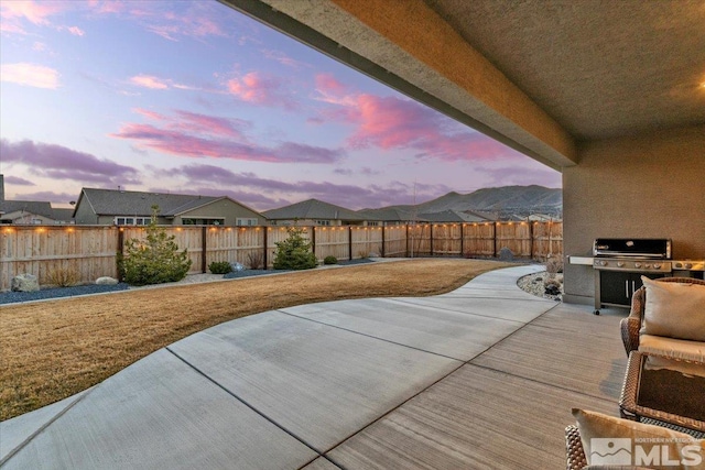 908 Sand Springs Dr, Sparks, NV 89441 - patio terrace at dusk with grilling area