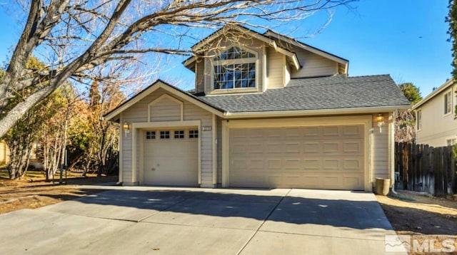 2510 Wolf Creek Dr, Reno, NV 89523 - view of front of home featuring concrete driveway, fence, a garage, and roof with shingles