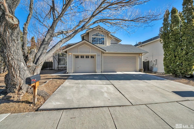 2510 Wolf Creek Dr, Reno, NV 89523 - traditional home with concrete driveway, an attached garage, and a garage