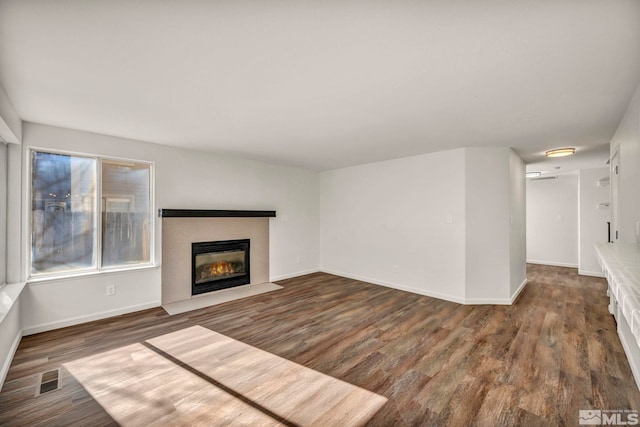 2510 Wolf Creek Dr, Reno, NV 89523 - unfurnished living room with wood finished floors, a fireplace with flush hearth, and baseboards