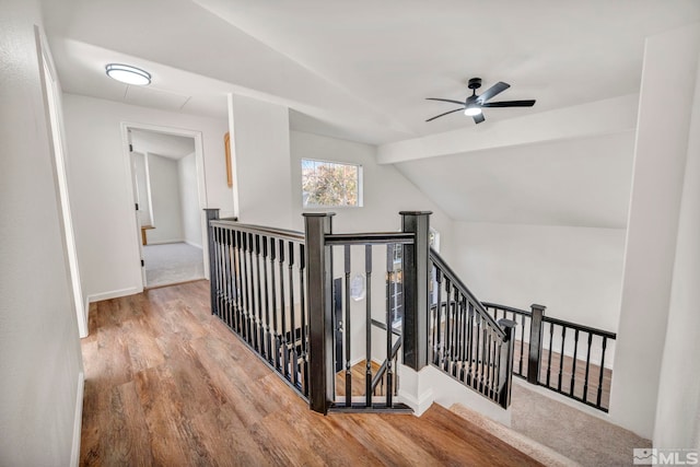 2510 Wolf Creek Dr, Reno, NV 89523 - hall with an upstairs landing, wood finished floors, vaulted ceiling, and baseboards