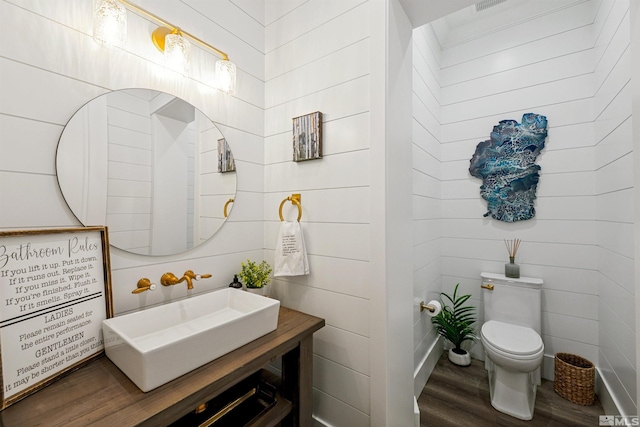 4312 Beaujolais St, Reno, NV 89511 - half bath with wood finished floors, toilet, and vanity