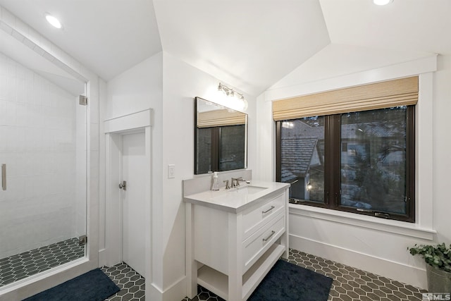 4312 Beaujolais St, Reno, NV 89511 - bathroom with lofted ceiling, vanity, tiled shower, recessed lighting, and baseboards