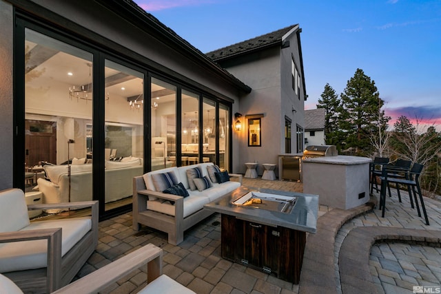 4312 Beaujolais St, Reno, NV 89511 - view of patio / terrace featuring an outdoor living space with a fire pit, exterior kitchen, and grilling area