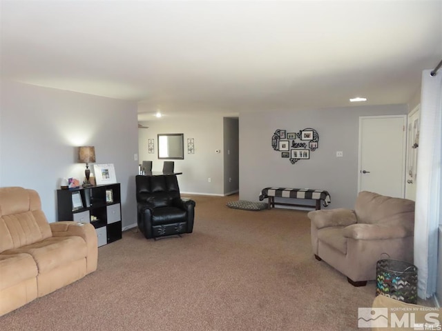 living area with carpet flooring and baseboards