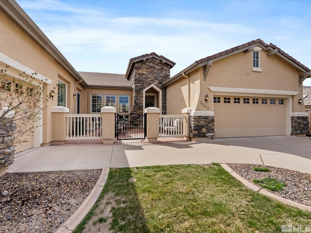 3502 Painted Vista Dr, Reno, NV 89511 - view of front of house with stucco siding, stone siding, driveway, a gate, and an attached garage