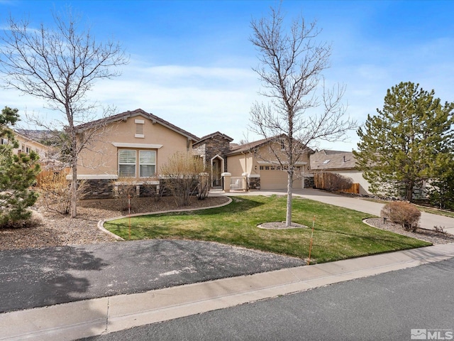 3502 Painted Vista Dr, Reno, NV 89511 - view of front of property with stucco siding, driveway, an attached garage, a front lawn, and stone siding