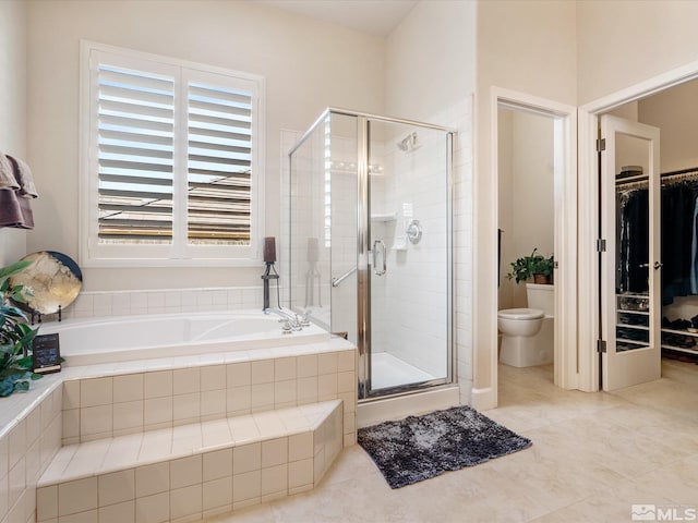 3502 Painted Vista Dr, Reno, NV 89511 - bathroom featuring a stall shower, a garden tub, toilet, and a spacious closet
